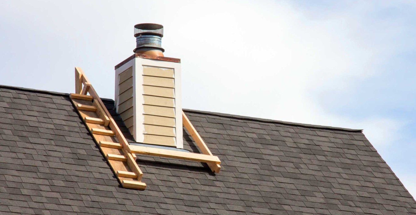 Chimney repair and rebuilding services on residential roof
